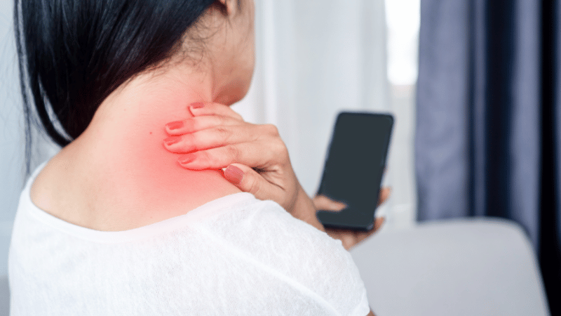 woman suffering from neck , shoulder pain using mobile phone too long with bad posture (1)